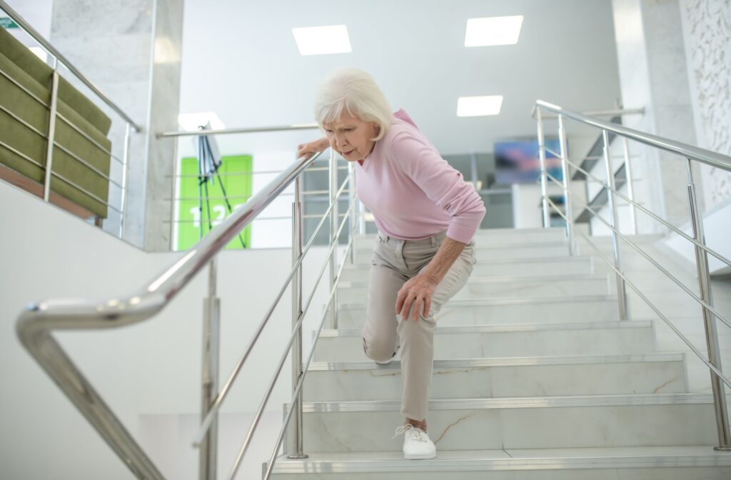 Elderly woman on stairs in a precarious position